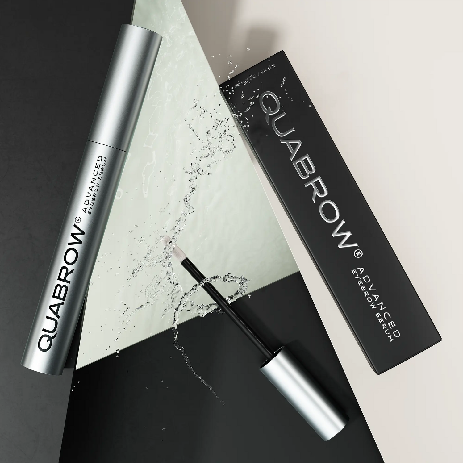 QUABROW Advanced Eyebrow Serum DUO with packaging and splash visual effect, laid on geometric surface